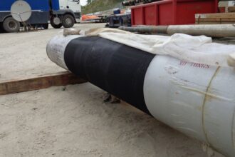 Industrial pipe with black coating.